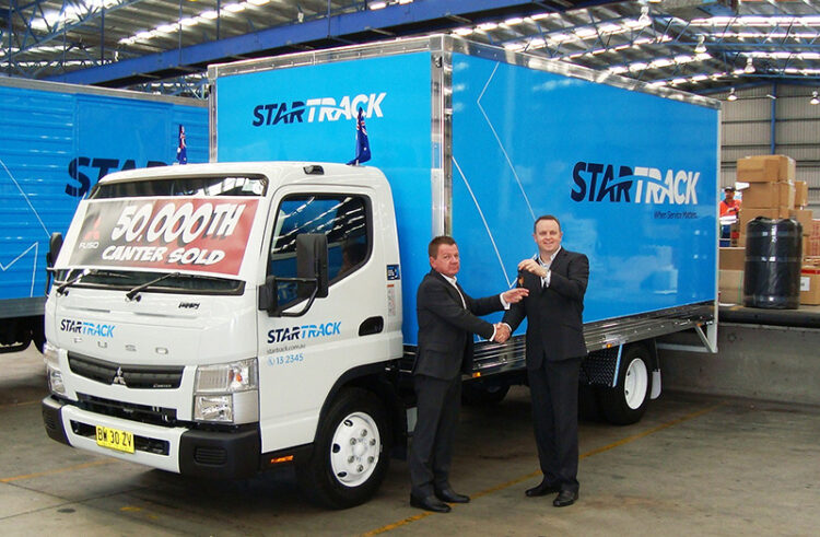 50,000th Canter presented to StarTrack at 9:30 am on Monday, August 5, 2013
From right: Mr. Brett Arandale, Fleet Sales Manager FUSO, handing over the key to Mr. Scott Gardiner, StarTrack Manager Multihaul and Fleet Operations