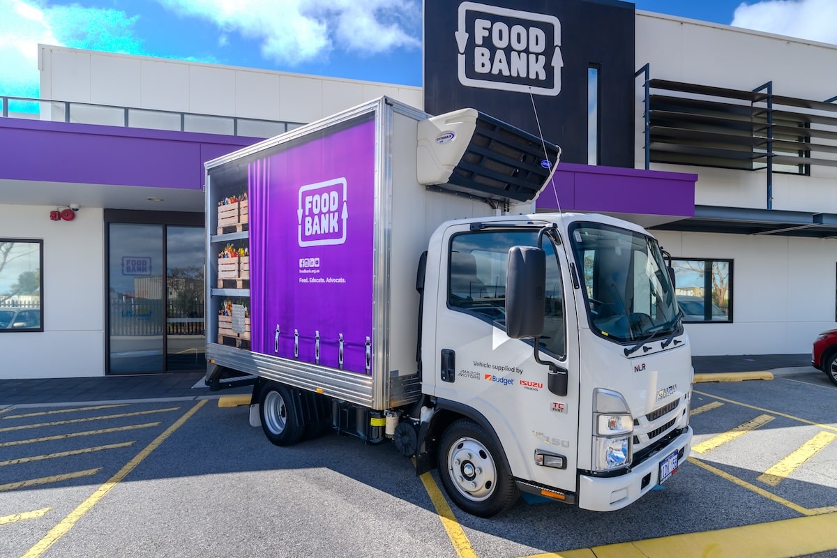 Isuzu NLR 45-150 outside of Foodbank WA's head office.
