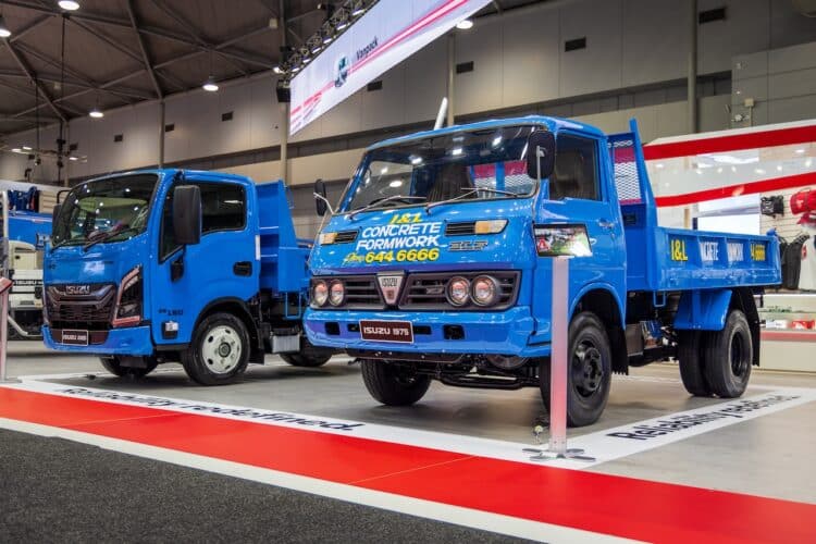 The KS11 Elf 350 Tipper alongside the MY25 NKR at The Brisbane Truck Show. Image: Isuzu Trucks.